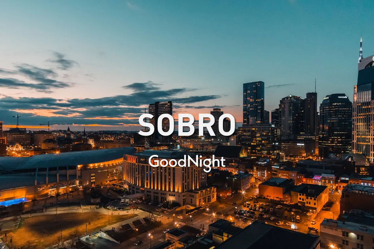 A panoramic cityscape of Nashville at sunset, with the urban skyline aglow and city lights beginning to twinkle. The energy of nightlife pulses through the image, hinting at the endless possibilities for dining, music, and after-dark exploration.