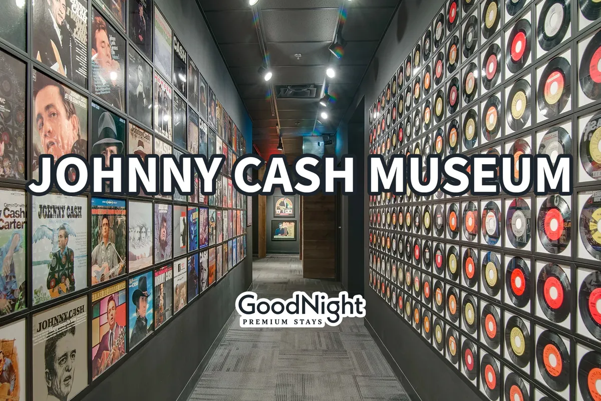 Inside the Johnny Cash Museum, guests are greeted by a striking wall of record albums, iconic portraits, and an inviting entrance to explore music history. The curated memorabilia creates a reflective and engaging atmosphere.